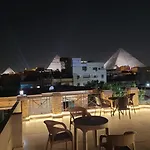 Khufu House Pyramids View